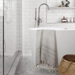 Grey striped bath towel with fringe