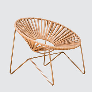 Side View of Modern Acapulco Chair in Natural Leather and Copper Legs