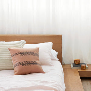 Leather Accent Pillow on Bed