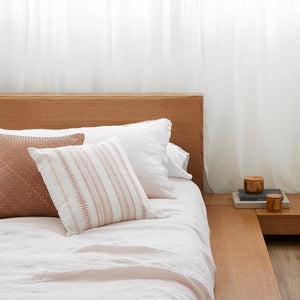Block Print Pillow and Leather Pillow on Bed